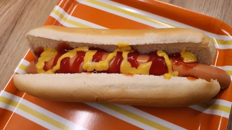 Classic hot dog in a bun with mustard and ketchup
