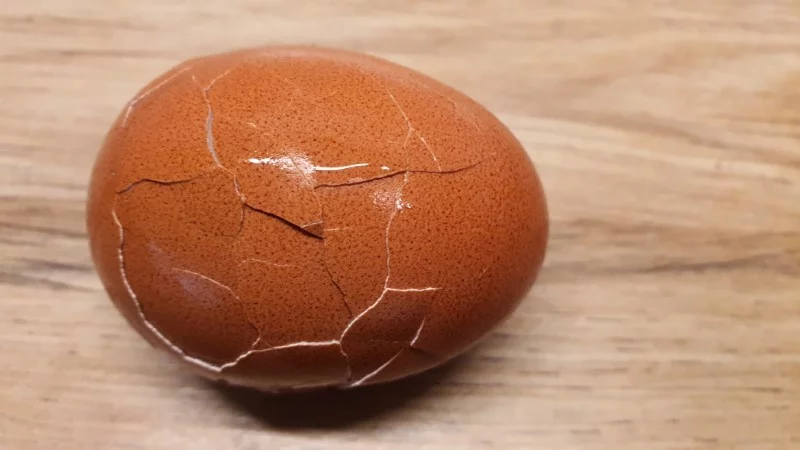 Hard-boiled egg with broken shell