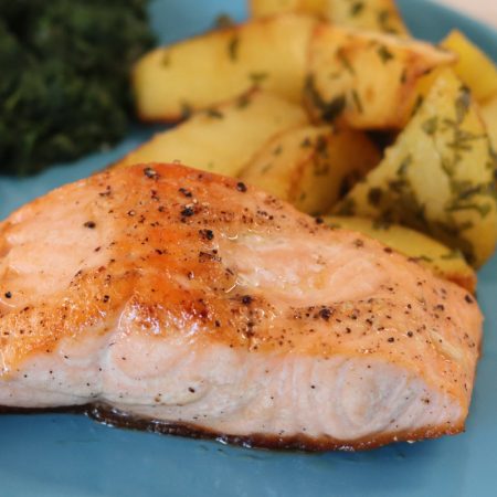 Baked salmon fillet with potatoes and garlic spinach square