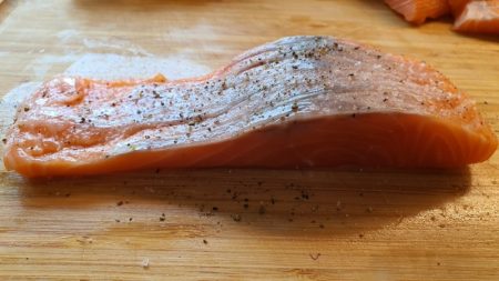 Preparing salmon fillet for baking