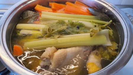 Chicken soup from whole chicken in pot
