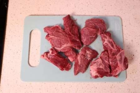 Preparing meat for Hungarian beef soup